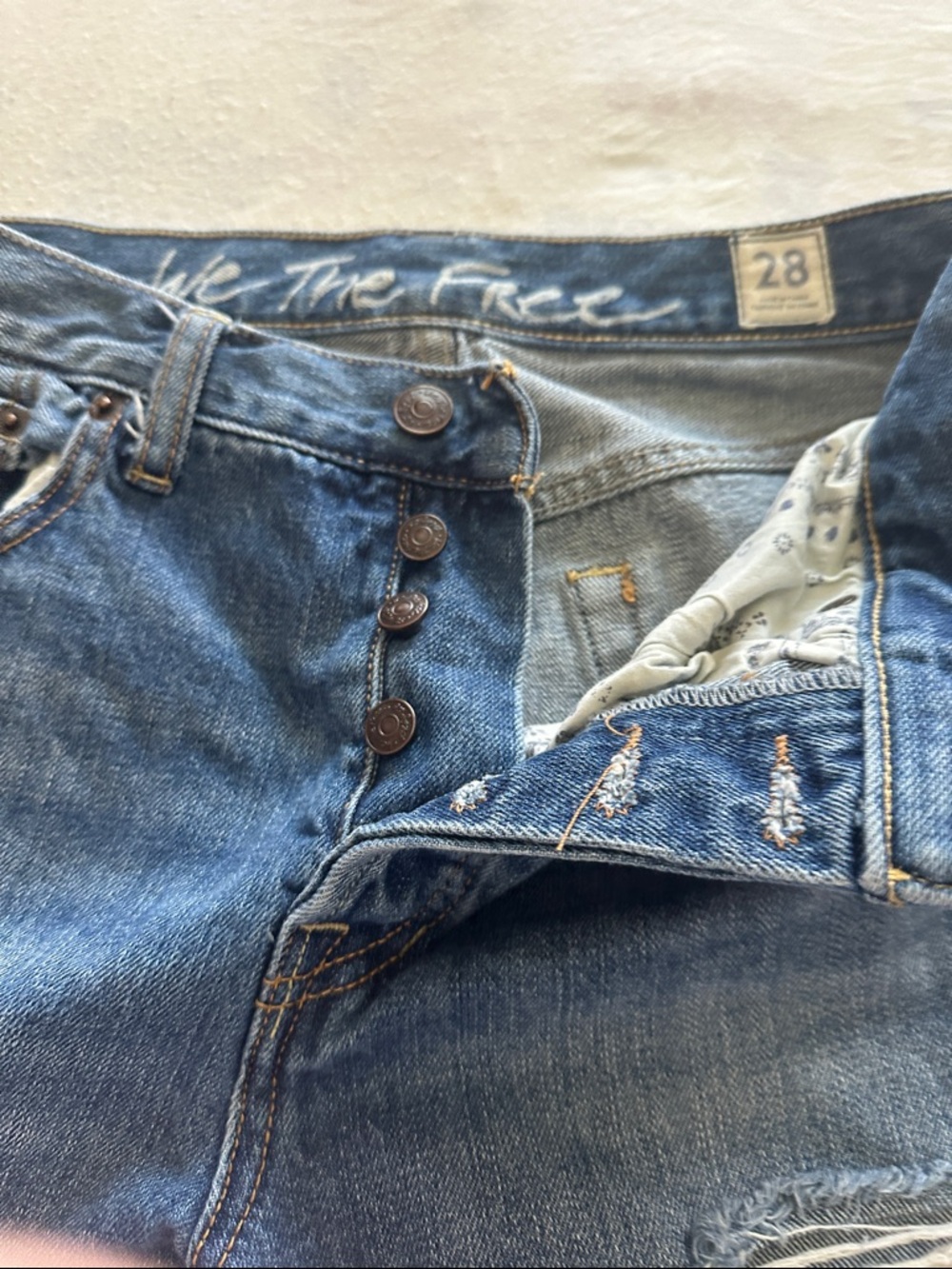 The Rail Distressed Denim Cutoff Shorts in Blue